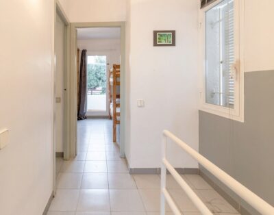 GRIFEU 15.1 – Casa adossada amb piscina comunitària i vistes