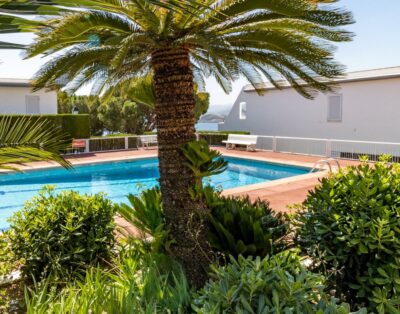 GRIFEU 15.1 – Casa adossada amb piscina comunitària i vistes